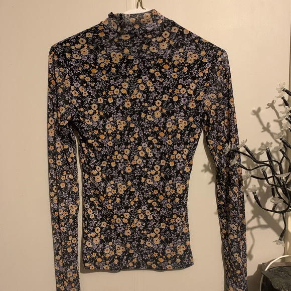 Long sleeve, mesh turtle neck with purple and yellow flowers. - Picture 1 of 4